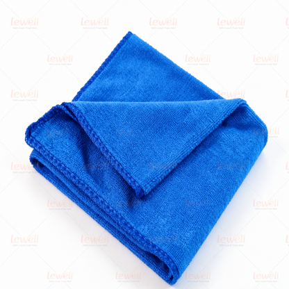 Blue microfiber cleaning cloth stack, folded with soft terry-like texture