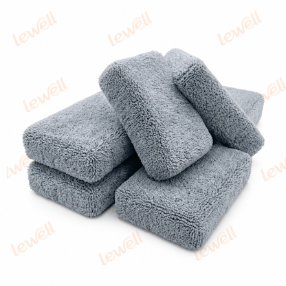 Gray microfiber applicator sponge blocks stacked, soft textured surface