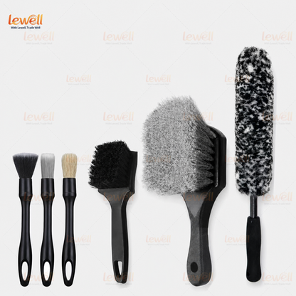 Assorted wheel cleaning brushes with black handles and mixed bristle textures