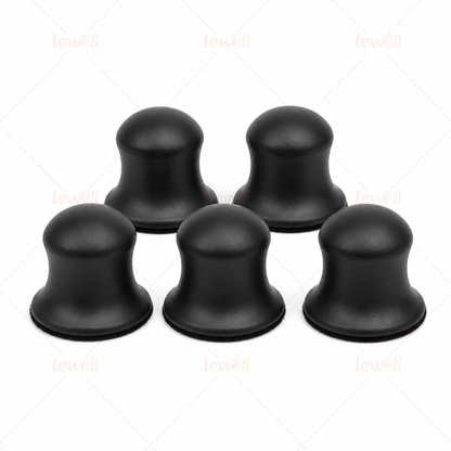 Set of black hook-and-loop sanding pads with domed foam tops