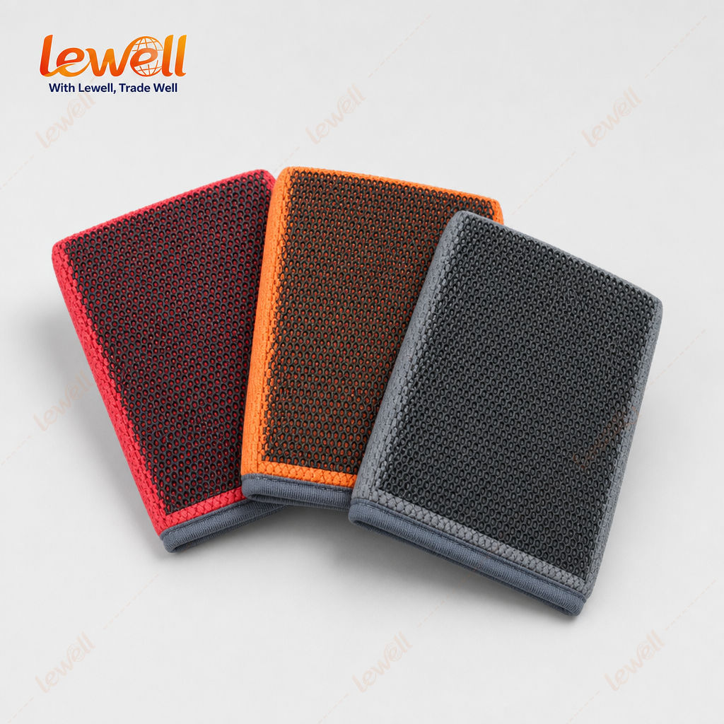Three clay wash mitts in red, orange, and dark grey with grid texture and blue edging.