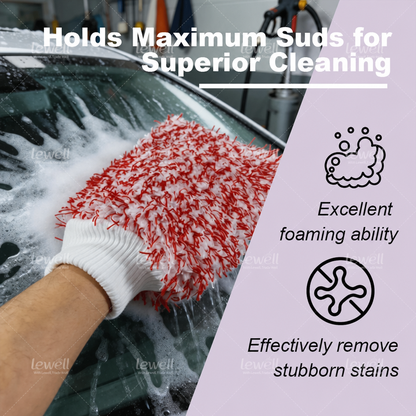 Red microfiber car wash mitt on hand, washing a vehicle window with suds