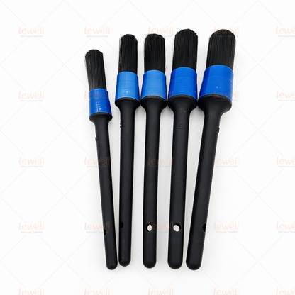 Car detailing brush set with black bristles, black handles, and blue end caps