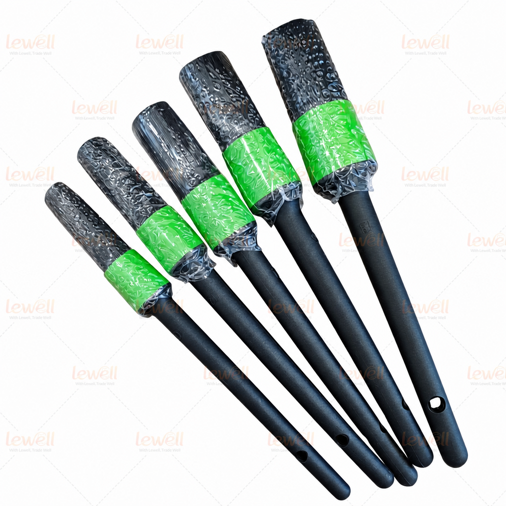 Car detailing brush set with black handles, green end caps, and black bristles