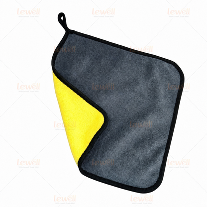 Single grey and yellow coral fleece detailing towel with black border and hanging loop