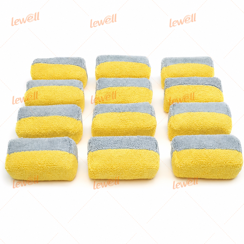 Yellow-and-gray striped microfiber detailing applicator sponge block set, neatly stacked